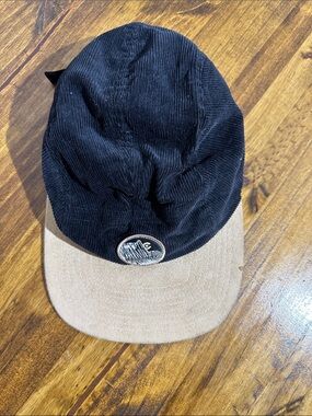 Men's Two-Tone Corduroy Cap in Black and Tan with Mountain Patch - Unbranded